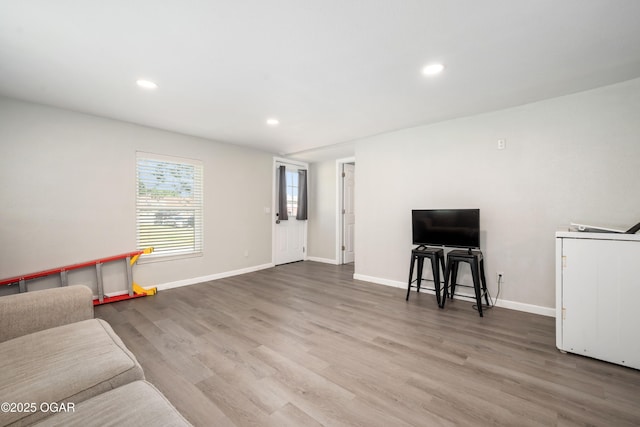 201 S Tom, Webb City, MO 64870 - living area with wood finished floors, baseboards, and recessed lighting