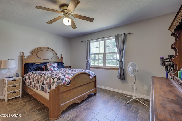 505 W Gault St, Carl Junction, MO 64834 - bedroom featuring dark wood finished floors, baseboards, a textured ceiling, and a ceiling fan