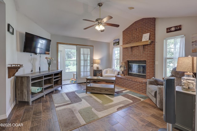 505 W Gault St, Carl Junction, MO 64834 - living area featuring vaulted ceiling, healthy amount of natural light, ceiling fan, wood finished floors, and a brick fireplace