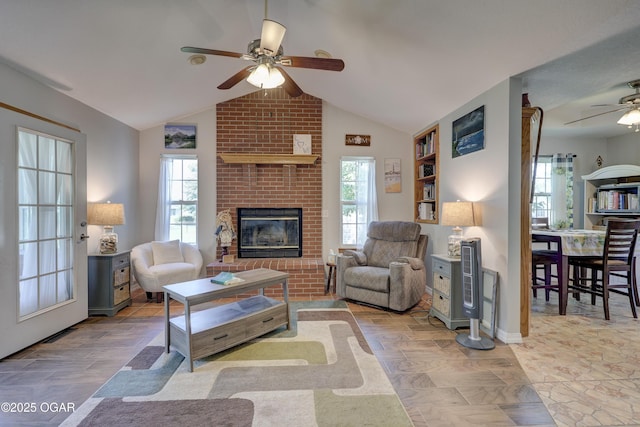 505 W Gault St, Carl Junction, MO 64834 - living area with a ceiling fan, healthy amount of natural light, lofted ceiling, a fireplace, and baseboards