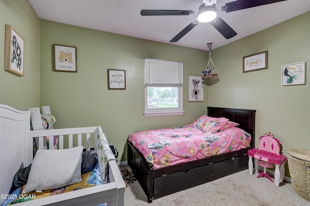 2408 Lincoln Ave, Baxter Springs, KS 66713 - bedroom with carpet floors, baseboards, and ceiling fan