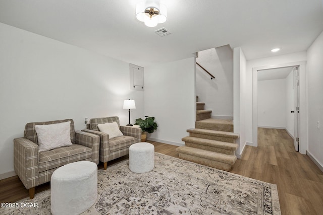 2716 E 14th St, Joplin, MO 64801 - living room featuring wood finished floors, stairway, baseboards, and recessed lighting
