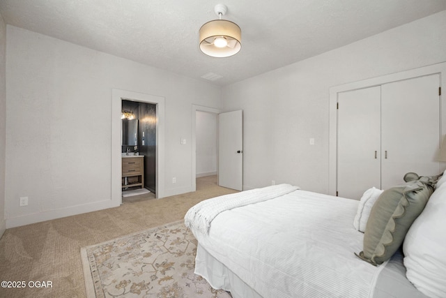 2716 E 14th St, Joplin, MO 64801 - bedroom featuring light carpet, a closet, ensuite bath, and baseboards