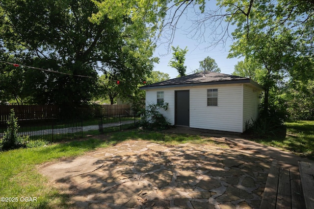 2716 E 14th St, Joplin, MO 64801 - rear view of house with an outdoor structure and a patio