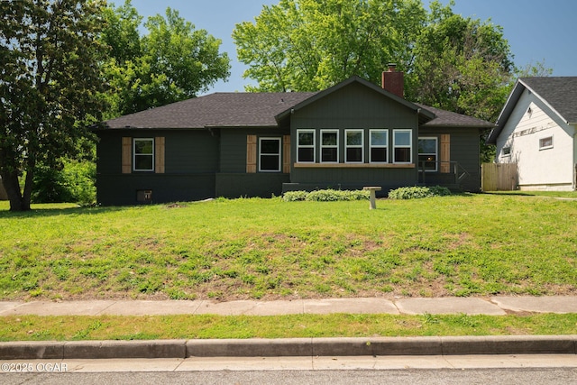 2716 E 14th St, Joplin, MO 64801 - view of front of home with a shingled roof and a chimney