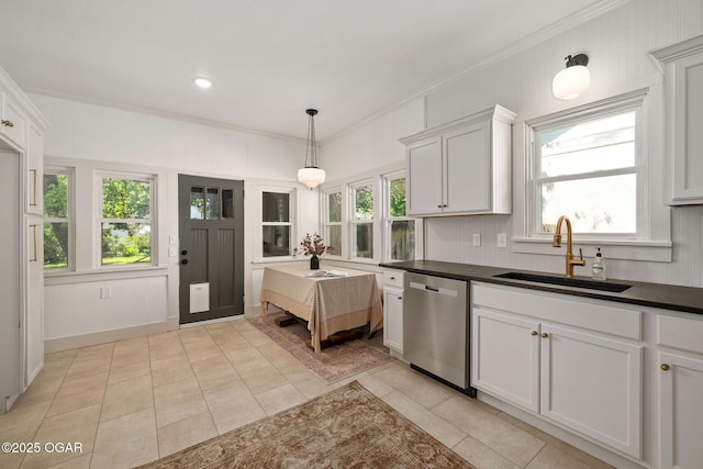 2716 E 14th St, Joplin, MO 64801 - kitchen featuring stainless steel dishwasher, a sink, dark countertops, ornamental molding, and plenty of natural light
