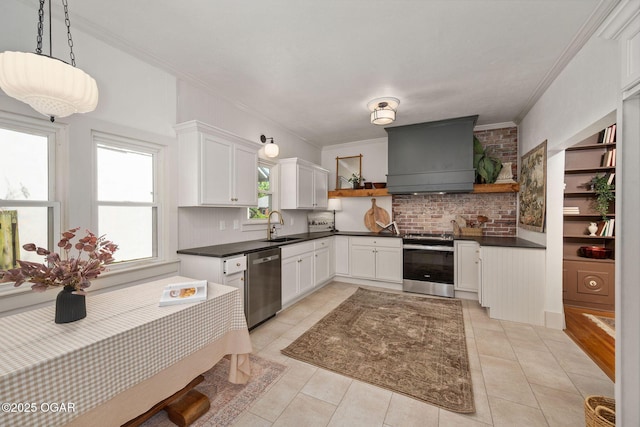 2716 E 14th St, Joplin, MO 64801 - kitchen with appliances with stainless steel finishes, custom range hood, open shelves, a sink, and crown molding