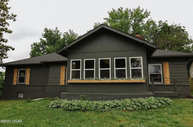 2716 E 14th St, Joplin, MO 64801 - view of side of home featuring a chimney, roof with shingles, and a yard