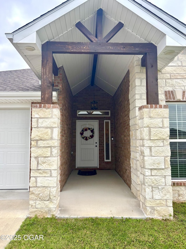 2005 Eagle Dr, Neosho, MO 64850 - entrance to property with a garage, stone siding, and brick siding