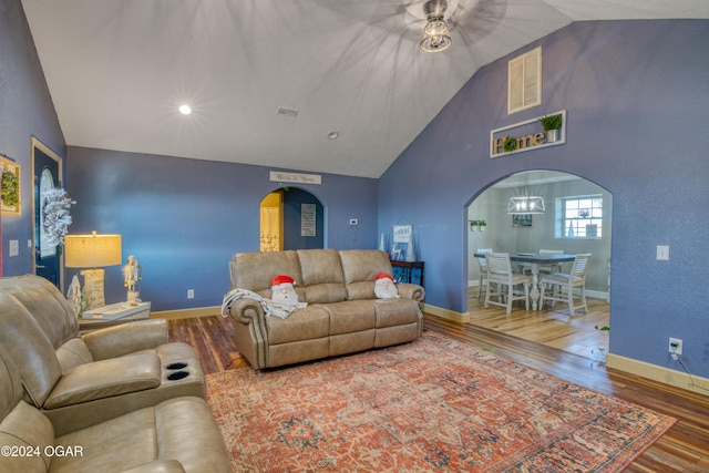 2228 Possum Trot Rd, Billings, MO 65610 - living room with arched walkways, wood finished floors, high vaulted ceiling, baseboards, and a ceiling fan