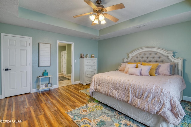 2228 Possum Trot Rd, Billings, MO 65610 - bedroom featuring wood finished floors, baseboards, and ensuite bath