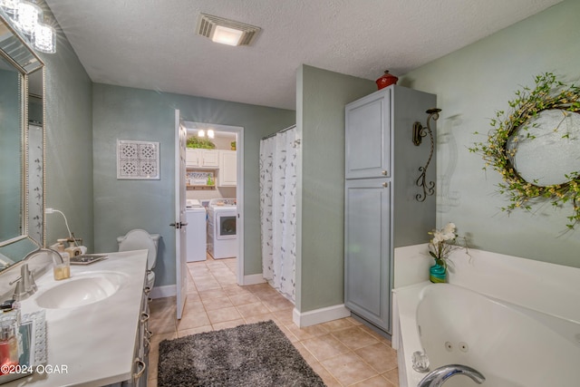2228 Possum Trot Rd, Billings, MO 65610 - bathroom with washing machine and dryer, vanity, a tub with jets, curtained shower, and tile patterned flooring