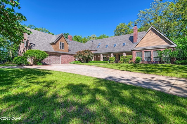 4 Emerald Dr, Joplin, MO 64804 - view of front of home featuring a chimney, concrete driveway, and a front lawn