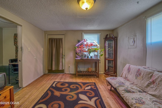 2201 S Main St, Galena, KS 66739 - sitting room with hardwood / wood-style floors, a textured ceiling, and baseboards