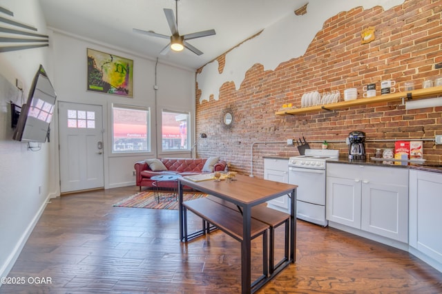204W9TH & Ave, Baxter Springs, KS 66713 - kitchen with white electric range, ceiling fan, brick wall, dark wood-type flooring, and white cabinetry