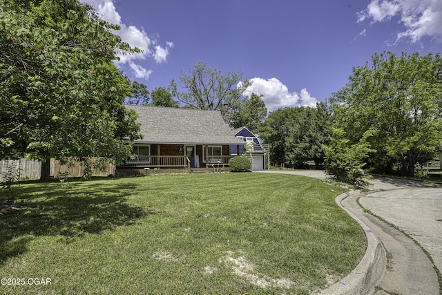 3219 Hughes Ave, Parsons, KS 67357 - view of front facade featuring covered porch, a garage, a front yard, driveway, and a shingled roof