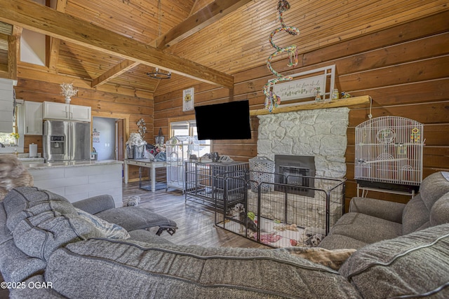 3219 Hughes Ave, Parsons, KS 67357 - living room with wood walls, hardwood / wood-style floors, and wooden ceiling