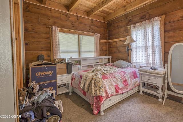 3219 Hughes Ave, Parsons, KS 67357 - bedroom with wood ceiling with exposed beams, multiple windows, wooden walls, and carpet
