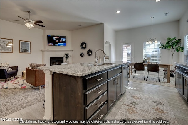1702 Sedge St, Joplin, MO 64801 - kitchen featuring a sink, open floor plan, dishwasher, light wood-style floors, and recessed lighting