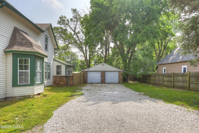 109 N Main St, Alba, MO 64830 - view of yard featuring a detached garage and an outbuilding