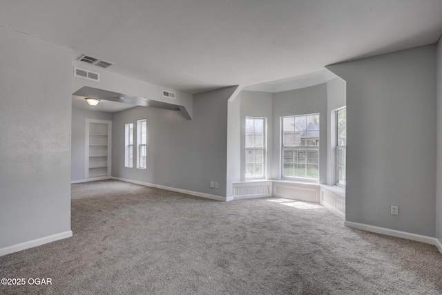 109 N Main St, Alba, MO 64830 - carpeted empty room with baseboards