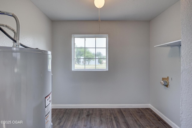 109 N Main St, Alba, MO 64830 - laundry room featuring water heater, wood finished floors, and baseboards