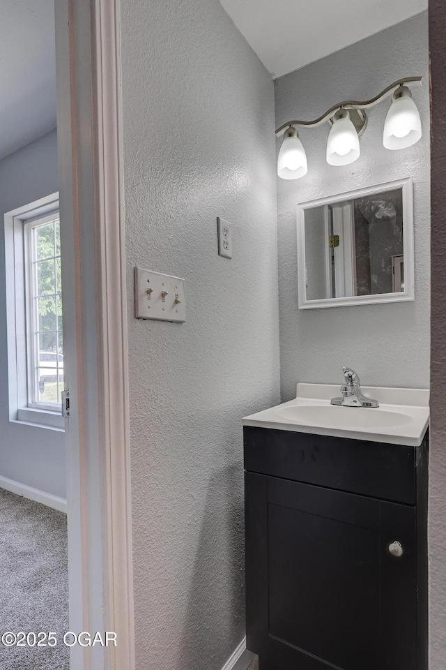 109 N Main St, Alba, MO 64830 - bathroom featuring vanity and baseboards