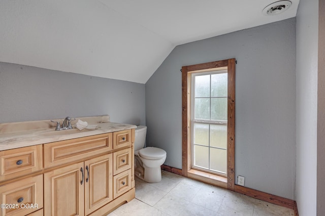 109 N Main St, Alba, MO 64830 - bathroom with toilet, lofted ceiling, and vanity