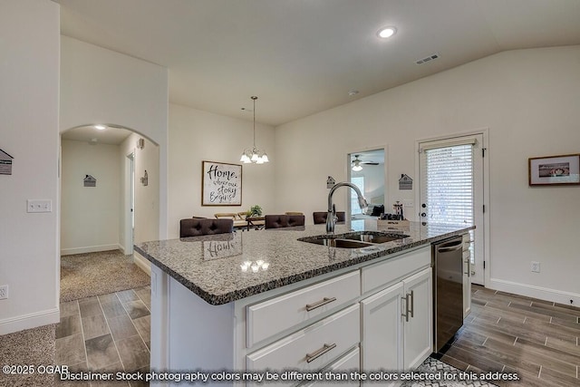 1619 Sedge St, Joplin, MO 64801 - kitchen featuring a sink, dishwasher, arched walkways, wood tiled floors, and vaulted ceiling