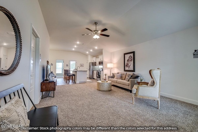 1619 Sedge St, Joplin, MO 64801 - living room with vaulted ceiling, light colored carpet, a ceiling fan, and baseboards