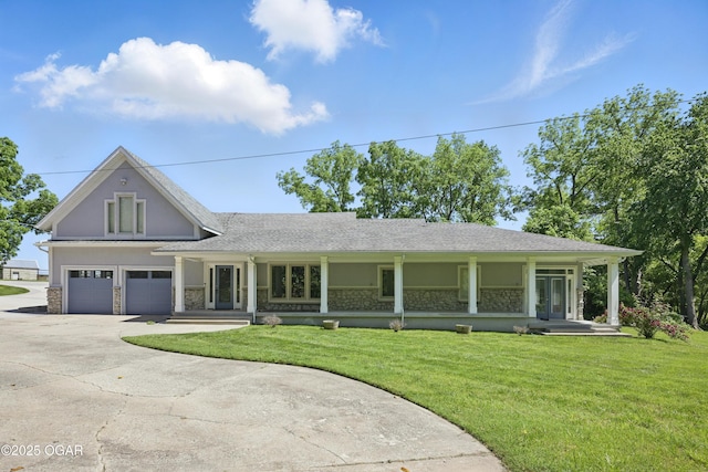 5594 Riverside Dr, Joplin, MO 64804 - view of front of property with stone siding, driveway, a front lawn, and stucco siding