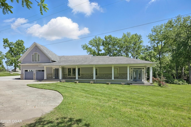 5594 Riverside Dr, Joplin, MO 64804 - view of front of property with driveway, a porch, a garage, and a front lawn