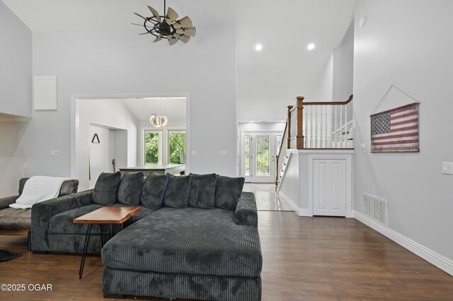 5594 Riverside Dr, Joplin, MO 64804 - living room with wood finished floors, stairs, baseboards, high vaulted ceiling, and recessed lighting