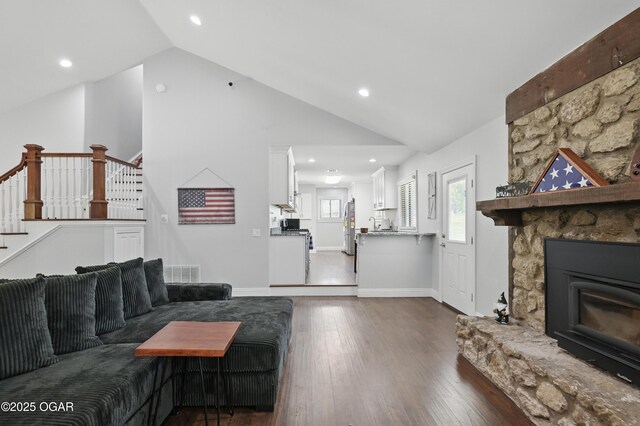 5594 Riverside Dr, Joplin, MO 64804 - living area featuring dark wood-style flooring, stairs, recessed lighting, and high vaulted ceiling