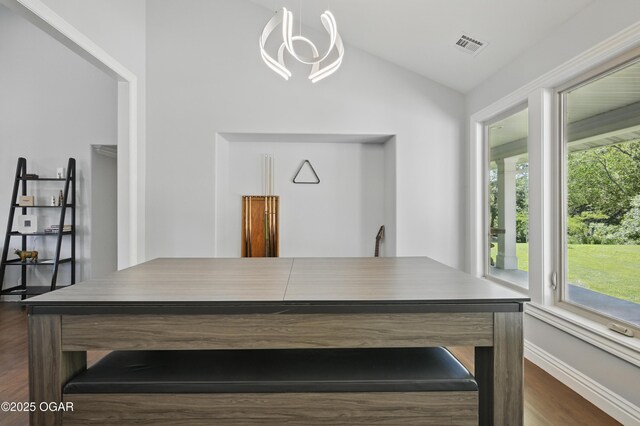 5594 Riverside Dr, Joplin, MO 64804 - home office with lofted ceiling, dark wood-type flooring, plenty of natural light, and a chandelier