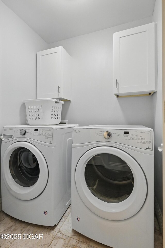 5594 Riverside Dr, Joplin, MO 64804 - laundry room featuring cabinet space, independent washer and dryer, and light marble finish flooring