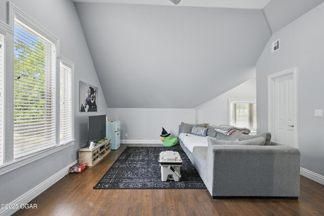 5594 Riverside Dr, Joplin, MO 64804 - living room featuring vaulted ceiling, baseboards, and wood finished floors
