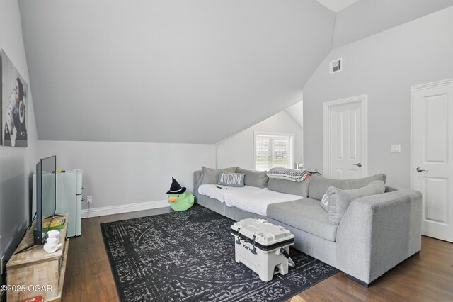 5594 Riverside Dr, Joplin, MO 64804 - living area with vaulted ceiling, dark wood finished floors, and baseboards