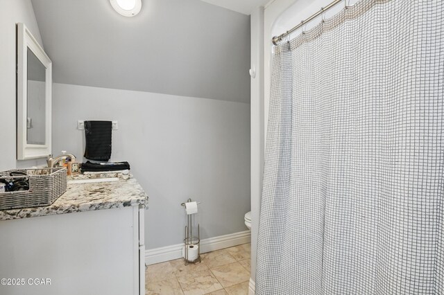 5594 Riverside Dr, Joplin, MO 64804 - full bathroom with vanity, toilet, baseboards, marble finish flooring, and a shower with curtain
