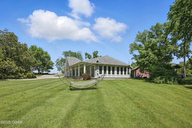 5594 Riverside Dr, Joplin, MO 64804 - rear view of property with a yard