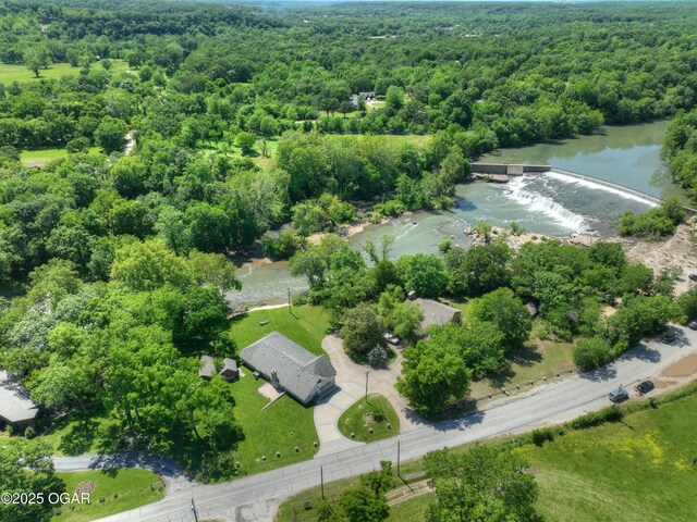 5594 Riverside Dr, Joplin, MO 64804 - drone / aerial view of a heavily wooded area and a large body of water