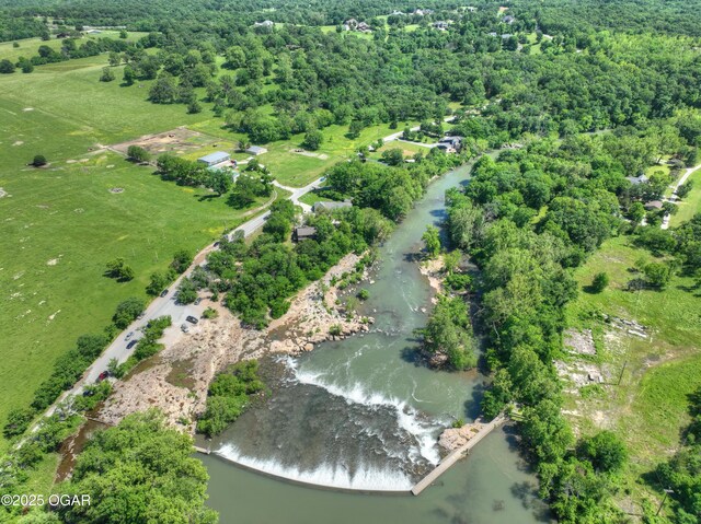 5594 Riverside Dr, Joplin, MO 64804 - view of property location featuring a large body of water, rural landscape, and a heavily wooded area