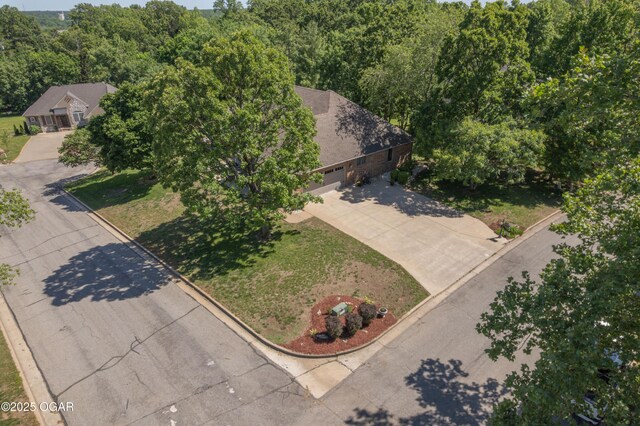 2402 Melissa Ln, Joplin, MO 64804 - aerial view of property and surrounding area featuring a heavily wooded area