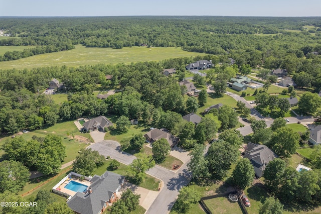 2402 Melissa Ln, Joplin, MO 64804 - aerial view of property and surrounding area featuring a heavily wooded area, nearby suburban area, and a pool area