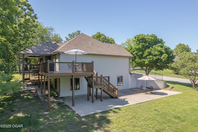 2402 Melissa Ln, Joplin, MO 64804 - rear view of property featuring stairway, a deck, a patio area, and roof with shingles