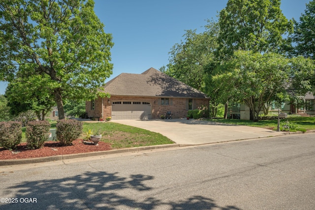 2402 Melissa Ln, Joplin, MO 64804 - view of front of home featuring a garage, concrete driveway, and brick siding