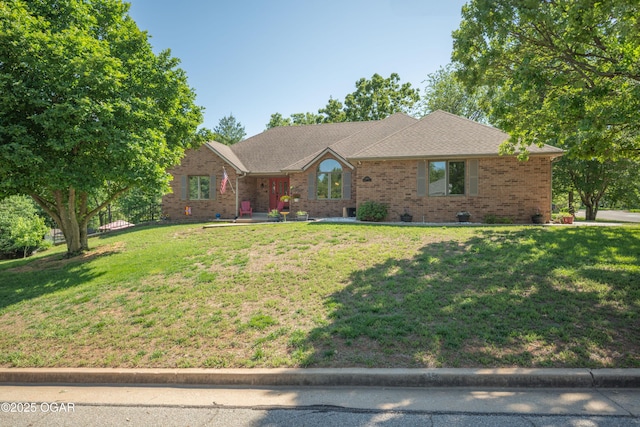2402 Melissa Ln, Joplin, MO 64804 - ranch-style home with a front lawn and brick siding