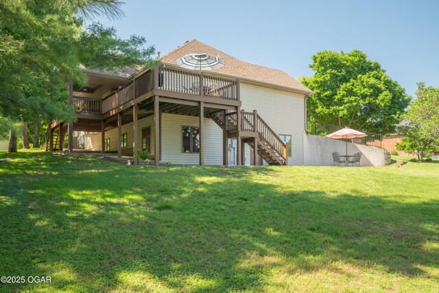 2402 Melissa Ln, Joplin, MO 64804 - rear view of house with stairs, a wooden deck, a lawn, and roof with shingles