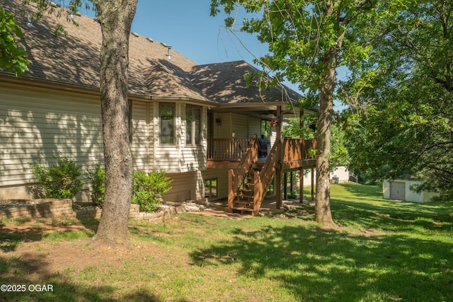 2402 Melissa Ln, Joplin, MO 64804 - view of side of home with a yard, a shingled roof, and stairway