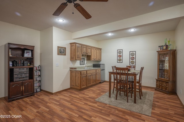 2402 Melissa Ln, Joplin, MO 64804 - dining room featuring dark wood-style flooring, a ceiling fan, recessed lighting, and baseboards